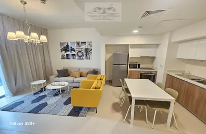 Living / Dining Room image for: Apartment - 2 Bedrooms - 2 Bathrooms for rent in Marassi Boulevard - Diyar Al Muharraq - Muharraq Governorate, Image 1