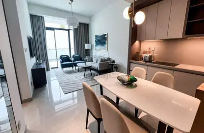 Living / Dining Room image for: Apartment - 1 Bedroom - 2 Bathrooms for rent in The Address Residences - Diyar Al Muharraq - Muharraq Governorate, Image 1