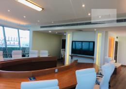 Office facing highway with gym and parking