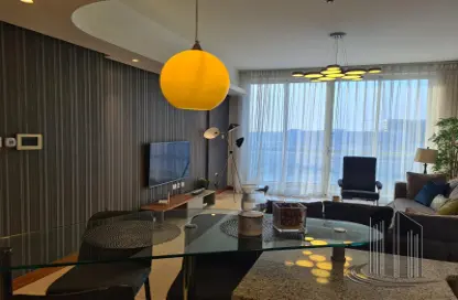 Living / Dining Room image for: Apartment - 1 Bedroom - 2 Bathrooms for sale in Dilmunia Island - Muharraq Governorate, Image 1