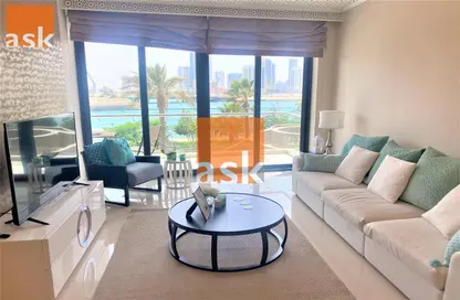 Living Room image for: Apartment - 1 Bedroom - 2 Bathrooms for sale in Reef Island - Capital Governorate, Image 1