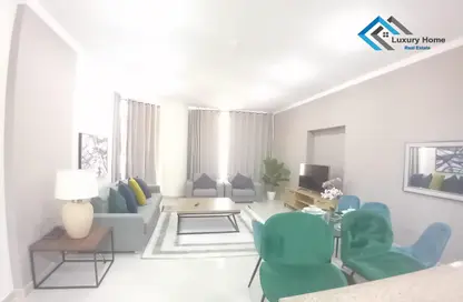 Living / Dining Room image for: Apartment - 2 Bedrooms - 2 Bathrooms for rent in Busaiteen - Muharraq Governorate, Image 1