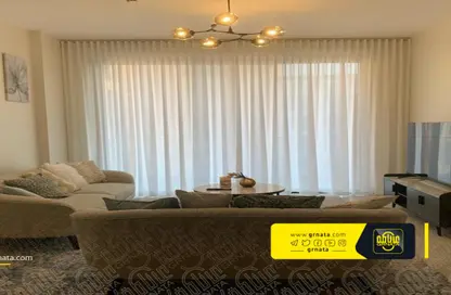 Living Room image for: Apartment - 2 Bedrooms - 2 Bathrooms for rent in Diyar Al Muharraq - Muharraq Governorate, Image 1