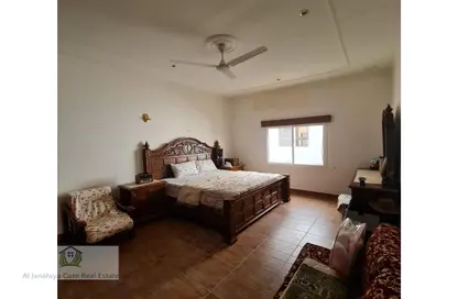 Room / Bedroom image for: Villa - 7 Bathrooms for sale in Arad - Muharraq Governorate, Image 1