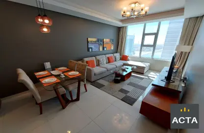 Living / Dining Room image for: Apartment - 1 Bedroom - 2 Bathrooms for rent in Al Juffair - Capital Governorate, Image 1