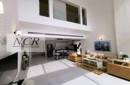 Living Room image for: Duplex - 1 Bedroom - 2 Bathrooms for sale in Al Juffair - Capital Governorate, Image 1
