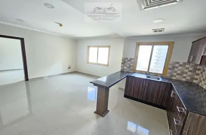 Kitchen image for: Apartment - 2 Bedrooms - 2 Bathrooms for rent in Busaiteen - Muharraq Governorate, Image 1