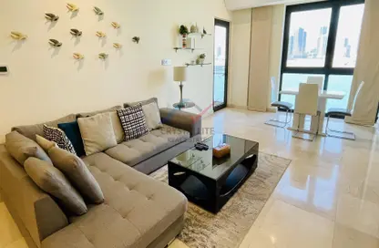 Living / Dining Room image for: Apartment - 1 Bedroom - 2 Bathrooms for sale in Reef Island - Capital Governorate, Image 1