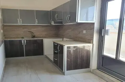 Kitchen image for: Apartment - 2 Bedrooms - 2 Bathrooms for rent in Arad - Muharraq Governorate, Image 1
