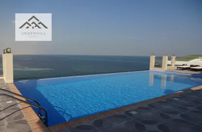 Pool image for: Apartment - 2 Bedrooms - 2 Bathrooms for sale in Danat Al Bahrain - Southern Governorate, Image 1