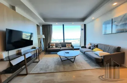 Living Room image for: Apartment - 1 Bedroom - 2 Bathrooms for sale in Essence of Dilmunia - Dilmunia Island - Muharraq Governorate, Image 1